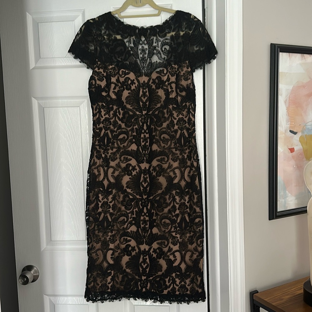 Tadashi shoji below knee length black lace with nude underlining.
